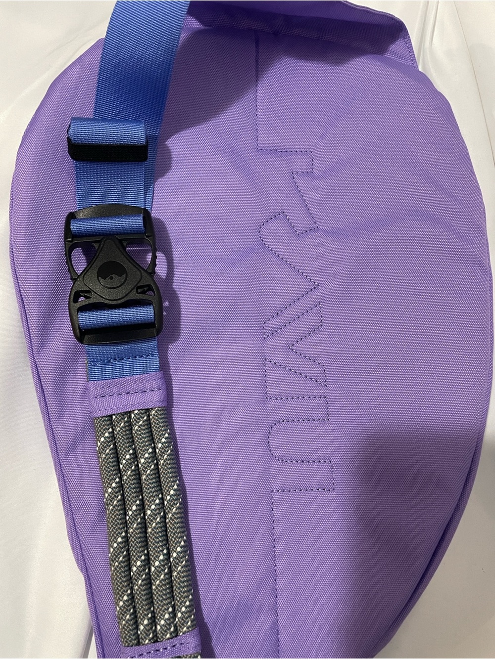 Lavender Kavu Sling Bag with Blue Straps